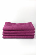 Stack of purple fabric on a white background