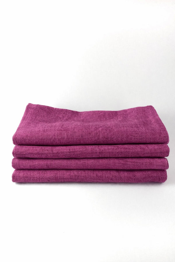 Stack of purple fabric on a white background